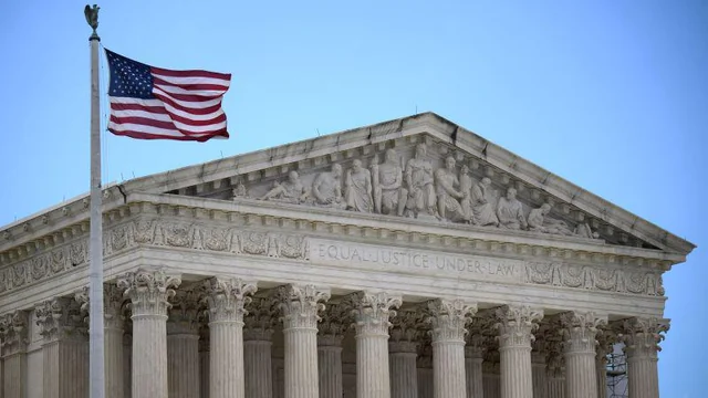 US Supreme Court building with American flag